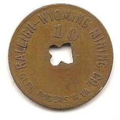 an old token with the number one on it