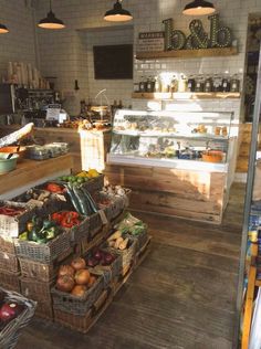 the inside of a grocery store filled with fresh fruits and vegetables