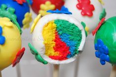 cake pops with colorful frosting on top of them