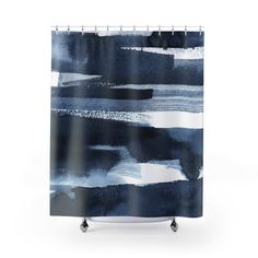 a shower curtain with blue and white watercolor paint strokes on the outside of it