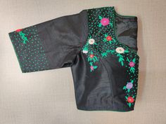 Beautiful black designer saree blouse with colorful embroidery. Buy designer blouse in USA from Pure Elegance. Disclaimer: The actual product may vary slightly from the image. These are custom orders, hence expect slight variation in color, placement of the motif or buta. ESTIMATED DELIVERYBecause this is a custom order, it would take about 2 weeks from the date of purchase. RETURN POLICY: This product is a custom order and cannot be returned or exchanged. Designer Embroidered Black Saree, Black Chanderi Embroidered Saree Fabric, Designer Black Blouse Piece For Festivals, Designer Black Blouse For Festivals, Black Blouse Piece For Designer Festivals, Festive Black Embroidered Top With Floral Details, Festive Black Embroidered Floral Top, Festive Black Floral Embroidered Top, Unstitched Black Blouse Piece With Resham Embroidery