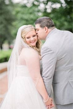 a bride and groom pose for a wedding photo