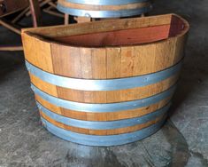 two wooden barrels sitting next to each other