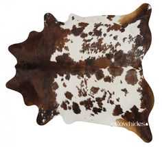 two brown and white cowhide rugs on a white background, one is laying down