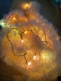 a bunch of lights that are on top of a cake tinsel covered in tinsel