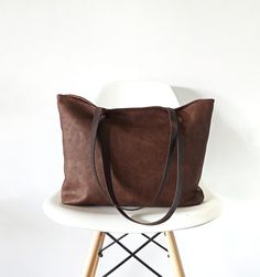 "Large tote bag made of good quality vegan faux leather in rich chocolate brown color with distressed look. The material is very soft and has matte finish. *Cotton lining in light brown * Two slip inner pockets *Magnetic snap closure. *The straps are made of cowhide leather in dark brown for extra support. This is the perfect carry-all bag! It is large but at the same time very light . Goes perfectly with any outfit! Dimensions: Opening: 17\" Height: 13\" Depth: 3\" *Please note that the color m Polynesian Art, Slouchy Tote, Large Leather Tote Bag, Chocolate Brown Colour, Large Leather Tote, Vegan Leather Bag, Brown Leather Bag, Handbag Leather, Brown Handbag