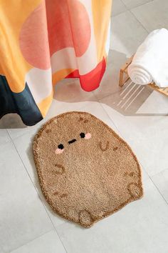 a bathroom with a rug that looks like a face