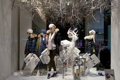 several mannequins dressed in winter clothing and hats