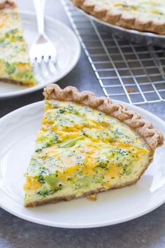 a slice of broccoli quiche on a plate with a fork next to it