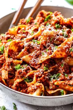 a pan filled with pasta and meat sauce