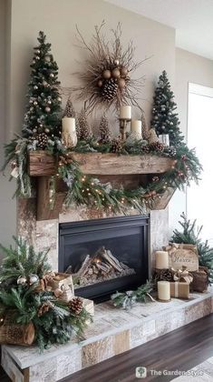 a fireplace decorated for christmas with pine cones, candles and evergreens on the mantle