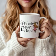 a woman holding a coffee mug that says, just a girl who is building her career