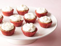 cupcakes with white frosting on a plate