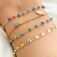 The Anklet Bracelet Evil Eye is a talisman of protection against all the negative energy that exists; we have four different models for you to choose the one that best suits your taste. Protect yourself from external points with these cute evil eye bracelets. Combine them or use them separately. Separate yours, and I will prepare it for you! ITEM DESCRIPTION -Material: -Gold Filled -Hamsa Hand Anklet  -Anklet Length: 10inches (Width: 2mm) -Heart Evil Eye Anklet (Width: 5mm) -Multicolor Evil Eye Handmade Spiritual Anklets As Gift, Spiritual Handmade Anklets As Gift, Adjustable Evil Eye Anklets As Gift, Colorful Evil Eye, Evil Eye Anklet, Eye Bracelets, Bracelet Evil Eye, Hamsa Bracelet, Turkish Evil Eye