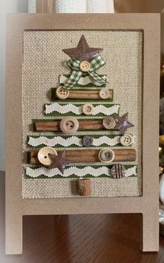 a christmas tree made out of wood and buttons