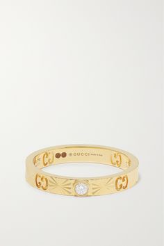 'GG' monograms trace Gucci's ring, along with a single bezel-set diamond. Perfect for stacking, it's crafted from 18-karat gold and engraved with sun rays - a subtle detail that makes catching the light beautiful. Gucci Gold Wedding Ring, Gucci Gold Rings For Wedding, Gucci Fine Jewelry With Diamond Accents, Gucci Jewelry With Diamond Accents For Gift, Designer Yellow Gold Brilliant Cut Diamond Ring, Designer Yellow Gold Diamond Ring With Brilliant Cut, Gucci Gold 14k Gold Rings, Gucci White Gold Jewelry With Diamond Accents, Gucci 14k Gold Rings For Formal Occasions