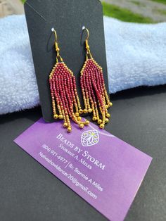 Burgundy & gold, brick stitch fringe earrings. Finished with gold medal earring hooks. Adjustable Gold Tassel Earrings With Fringe, Gold Beaded Fringe Tassel Dangle Earrings, Gold Beaded Fringe Dangle Tassel Earrings, Gold Beaded Fringe Tassel Earrings, Gold Beaded Fringe Earrings As Gift, Gold Beaded Fringe Earrings For Gifts, Gold Beaded Earrings With Fringe As Gift, Gold Beaded Dangle Earrings With Tassels, Gold Jewelry With Beaded Fringe For Gift