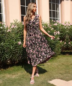 Our Nicolene Dress comes in a black base and pink floral prints. Like a queen, feel like you're wearing your crown of beauty in this exquisite maxi that features a plunging neckline, sleeveless, a-line skirt and a cut on the waist flattering your shape. The print designs add a classy finish and can be beautifully paired with a matinee crystal necklace. Size Guide: Melina is 5’6” tall, and has a 33.5” bust, 24.8”waist, & 37.4” hips. She is wearing a S / US 4 / AU 8. This dress is true to size. Ma Black Feminine V-neck Midi Dress, Black V-neck Maxi Dress In Feminine Style, Black Feminine V-neck Maxi Dress, Black V-neck Maxi Dress, Feminine Style, Black V-neck Feminine Maxi Dress, Black Floral Print V-neck Maxi Dress, Black Floral Print Maxi Dress With V-neck, Black V-neck Maxi Dress With Floral Print, Feminine Black Maxi Dress With Floral Print