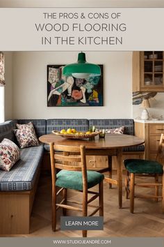 a kitchen with a table and chairs next to a bench