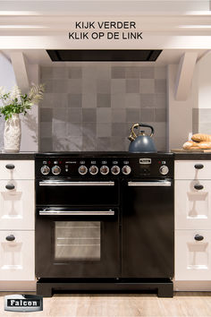 a black stove top oven sitting inside of a kitchen next to a white countertop