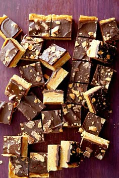 pieces of chocolate and peanut butter fudge on a wooden surface