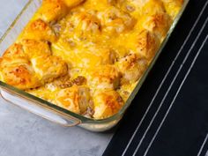 a casserole dish filled with chicken and cheese