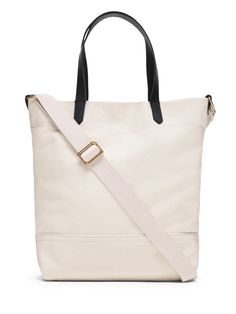 Our sturdy, cotton canvas tote is now available in a smaller size.  Use it as a daytime bag for your wallet and water bottle, or take it to work as a lunch bag.  Sturdy leather handles.  Snap tab closure.  One internal card slot.  Detachable shoulder strap.  Cotton canvas lining.  Height: 12. 5" (31. 75cm) Top width: 13" (33cm) Bottom width: 10" (25. 4cm) Depth: 5" (12. 7cm) Handle drop: 7. 5" (19cm) Casual Canvas Bucket Bag For Daily Use, Trendy Everyday Bags With Snap Closure, Modern Bucket Bag Tote With Snap Closure, Modern Tote Bucket Bag With Snap Closure, On-the-go Canvas Shoulder Bag With Leather Handles, Daily Use Coated Canvas Bucket Shoulder Bag, Beige Canvas Tote Bag With Adjustable Handle, Modern Snap Closure Bucket Tote Bag, Everyday Canvas Bucket Bag With Removable Pouch