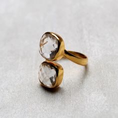 D E T A I L S - Stone: Crystal Material: 92.5 Sterling silver The fit : True to US ring size Finish: Smooth and Gold Plated to a high shine S H I P P I N G & P R O D U C T I O N - My current production time is 2-6 business days, which means after those days are up, your order ships! I make everything custom to order, by hand, but I promise you it's worth the wait! R U S H - M Y - O R D E R - If you're in a rush to get your pretty new pieces, please send me a message and I'll let you know jus Adjustable Gold Topaz Ring For Anniversary, Classic Stackable Topaz Ring As Gift, Classic Stackable Topaz Ring Gift, Adjustable Faceted Rings For Wedding, Stackable Topaz Ring As Gift, Stackable Topaz Ring Gift, Open Ring With Faceted Design For Wedding, Classic Adjustable Open Crystal Ring, Rose Cut Diamond Open Ring As Gift