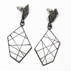 "A modern play on sterling silver dangle earrings. These earrings are hand made from recycled sterling silver sheet. The design is sawed by hand and polished to a matte finish. The silver has been oxidized to add depth and beauty. Solid 925 Sterling Silver About 2\" L x .75\" W Post style with deluxe Luxlock Backs-Safe, Secure, Comfortable Artisan made in Texas The earrings will arrive thoughtfully packaged in a signature jewelry box. Click here to see all of my earrings: https://www.etsy.com/sh Contemporary Sterling Silver Dangle Earrings, Anniversary Earrings With Oxidized Finish, Dangle Shape, Modern Geometric Sterling Silver Earrings, Artisan Nickel-free Rectangular Earrings, Sterling Silver Modernist Earrings, Sterling Silver Dangle Earrings, Signature Jewelry, Silver Earrings Dangle, Recycled Sterling Silver