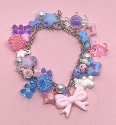 If pastels are your vibe, this is the ultimate pastel charm bracelet! This pastel kei charm bracelet is perfect for anyone that loves pastels or just love fairy kei jewelry. Pinks, blues, purple & white are all included in this pastel kei charm bracelet 💕  Don't forget to check out our charm bracelet section to view more. Product info: *Stainless steel & adjustable *Reaches up to 6.5 inches  *Beads are plastic and acrylic If you have any questions, please don't hesitate to send us a message! We Cute Adjustable Pastel Jewelry, Decora Kei Outfits, Handmade Fairy Kei Jewelry For Party, Fairy Kei Aesthetic, Adjustable Multicolor Kawaii Bracelets, Fairy Kei Accessories, Fairy Kei Jewelry, Kei Jewelry, Pink Handmade Fairy Kei Jewelry