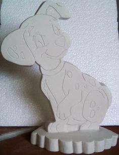 a paper cut out of a dog sitting on top of a table