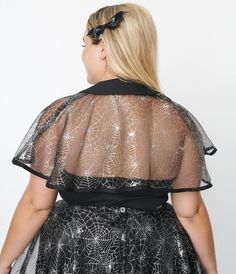 An enthralling addition to your Halloween ensemble, this thrilling black organza capelet dancing with silver spider webs. The solid black collar is secured with a self tie as it flows to a straight hem that dances above the elbows!Available in size S/M/L-4X/5X while supplies last Spider Webs, Plus Size Black, Spider Web, Unique Vintage, Solid Black, Magnolia, Dancing, Plus Size, Collar