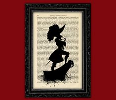 the silhouette of a girl on an old book page is framed in a black frame