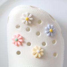 pastel daisy Flower shoe charm designs.  shoe charms   Matte finish 4 designs to choose from or get them all!  modeled on size 6w E3 Flower Shoes, Ivory White, Shoe Charms, Shoe Clips, Diy Shoes, Daisy Flower, Pink Blue, Brooch Pin, Daisy