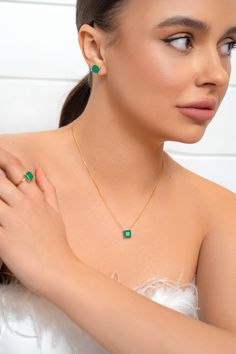 An indulgent set of necklace and earrings featuring sparkling paraiba stones, textures, and eye-catching shapes when worn together, adding life to your day or night wardrobe. NECKLACE & STUDS SET Metal Type: 925 sterling silver Metal Plate: Yellow Gold Plated Length: 16 + 2"Stone: Green Paraiba Sterling Silver Emerald Necklace, Fine Jewelry With Polished Emerald Finish, Fine Jewelry Pendant Sets As Gifts, Elegant Sterling Silver Emerald Necklace, Fine Jewelry Pendant Set Gift, Round Emerald Necklace As Gift, Fine Jewelry With Bezel Setting For May Birthstone, Emerald Gemstone Jewelry Sets As Gift, Sterling Silver Pendant Jewelry Sets