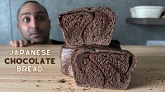 a man sitting at a table with some chocolate bread on it and the words japanese chocolate bread in front of him