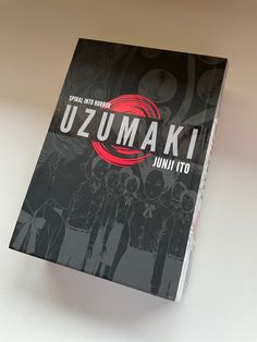 the front cover of a book with an image of some people in black and red