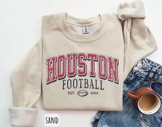 Vintage Houston Football Sweatshirt | Football Sunday Crewneck | Houston Football Shirt | Houston Fan Shirt | Houston Football Shirt ✨ Product Description: This comfortable and stylish crewneck sweatshirt is made from 50% cotton and 50% polyester. It is soft, warm, and durable, making it perfect for everyday wear. The sweatshirt features a crewneck, ribbed cuffs and hem. ✨Washing Instructions: Machine wash cold, inside out. Tumble dry low. Do not iron directly on the print. ✨ Sizing: Please refer to the listing photos for sizing information. ✨How It's Made: This sweatshirt is made by Gildan*, a leading manufacturer of apparel. The sweatshirt is made using a high-quality blend of cotton and polyester, which makes it soft, warm, and durable. The sweatshirt is also printed using direct-to-gar Varsity Style T-shirt With Relaxed Fit For Fall, Varsity Style Relaxed Fit T-shirt For Fall, Fall Varsity T-shirt With Lettering, Varsity T-shirt For Fall, Varsity Style Fall T-shirt, Relaxed Fit Sweatshirt With Text Print For Game Day, Relaxed Fit Text Print Sweatshirt For Game Day, Fall Varsity T-shirt With Ribbed Cuffs, Football Sunday