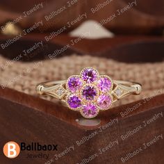 "MADE TO ORDER * Material: Solid gold(10K/14K/18K white/yellow/rose gold), Platinum * DETAILS - Center Stone: Lab Created Pink Sapphire - Center Stone Size: Round Cut 2.5mm*7psc - Center Stone  Carat Weight: Approx 0.56ct - Side stone: Natural Diamond - Total weight: 0.01 ctw (High Quality) - Cut: Round - Color: DF -  Clarity: VVS - Band Width: 1.5mm * Click on the \"Pin It\" icon if you like this item ✥ O T H E R ∙ I N F O R M A T I ON ✥ ♦ Your item will be nicely packed to gift in elegant jewelry boxes. ♦ Custom Order We can make custom rings in almost any shape and style. If you want a specific model, please send us a clear picture and we will do our best. ♦ Shipping Most items take 3-4 weeks to create.I'm happy to rush your order, fees may apply, write me for details. ♦ Payment Plans I Heirloom Pink Cluster Ring Gift, 14k Rose Gold Flower Ring For Anniversary, Rose Gold Flower Ring Stamped 14k For Anniversary, Yellow Gold Flower Jewelry With Halo Setting, Flower-shaped Yellow Gold Jewelry With Halo Setting, Yellow Gold Flower Shaped Diamond Ring For Gift, Yellow Gold Diamond Ring With Flower Shape For Gift, Yellow Gold Diamond Ring With Floral Design, Pink 14k Gold Flower Ring For Wedding