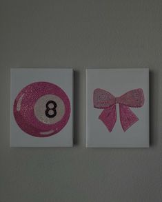 two pink and white cards with the number eight ball on them, one has a bow