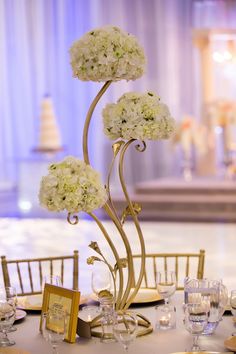 the centerpieces are adorned with white flowers