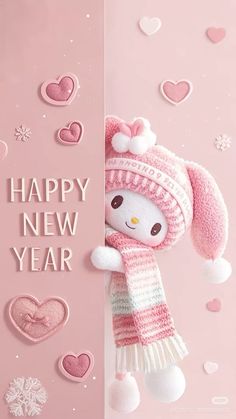 a stuffed animal wearing a pink hat, scarf and mittens is peeking out from behind a sign that says happy new year