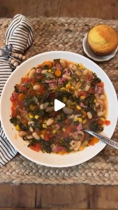 a white bowl filled with soup on top of a table