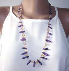 "This is a beautiful and original long statement necklace, amethyst necklace. Purple necklace of beaded genuine amethyst, ametrine, raw citrine beads and Japanese seed beads. February birth month necklace. The necklace is about 70 cm (27.5\") including clasp.  Beads threaded onto high quality Beadalon bead stringing wire. Keep in mind, please, a necklace may be placed on the neck differently depending on the neck size. Colors may vary depending on your monitor settings." Amethyst Crystal Necklace With Faceted Beads As Gift, Handmade Elegant Amethyst Beaded Necklaces, Elegant Amethyst Beaded Necklaces For Healing, Elegant Amethyst Beaded Necklace For Healing, Purple Gemstone Beaded Necklace As Gift, Purple Amethyst Beaded Necklace Gift, Amethyst Beaded Necklaces With Natural Stones As Gift, Elegant Amethyst Beaded Necklaces With Stones, Elegant Handmade Purple Crystal Necklaces