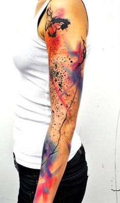 a woman with a tattoo on her arm