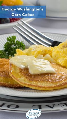 a white plate topped with pancakes covered in gravy