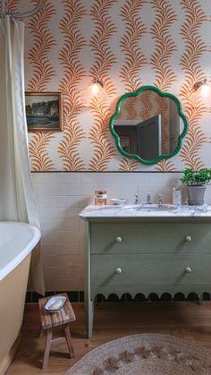 a bathroom with a sink, mirror and bathtub in the corner next to a rug