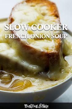 a close up of a bowl of soup with bread in it and the words slow cooker french onion soup