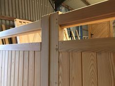 a close up of a wooden fence with wood slats on the top and bottom