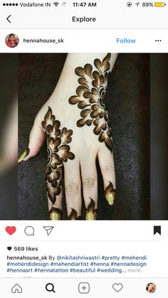 someone has henna on their hand and it looks like they have been painted with flowers